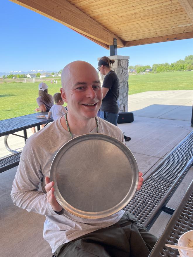 My holding a pizza plate.